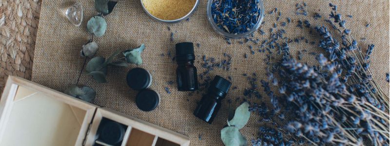 Dried lavender and essential oils on top of burlap